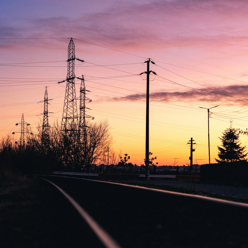 Transmission pylons at sunset